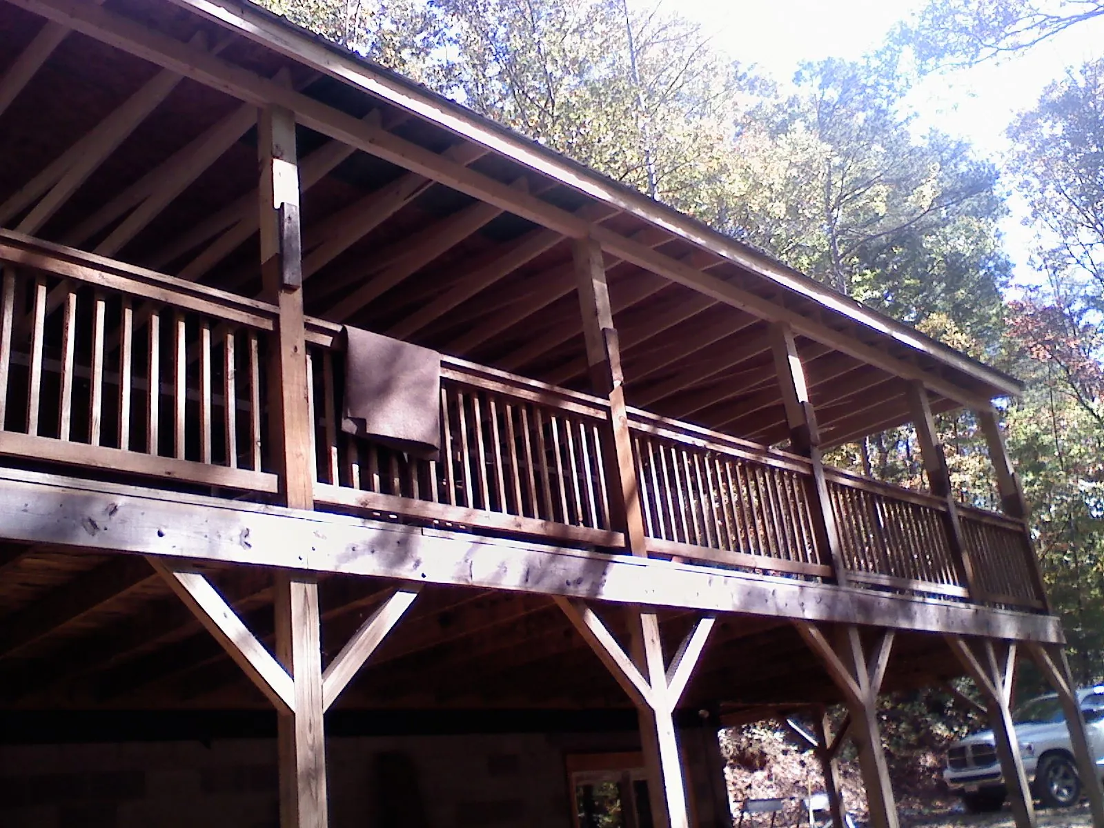 Timber framing under a new elevated porch and deck — Roof Leak Repair in New Salem by Roofing Brothers